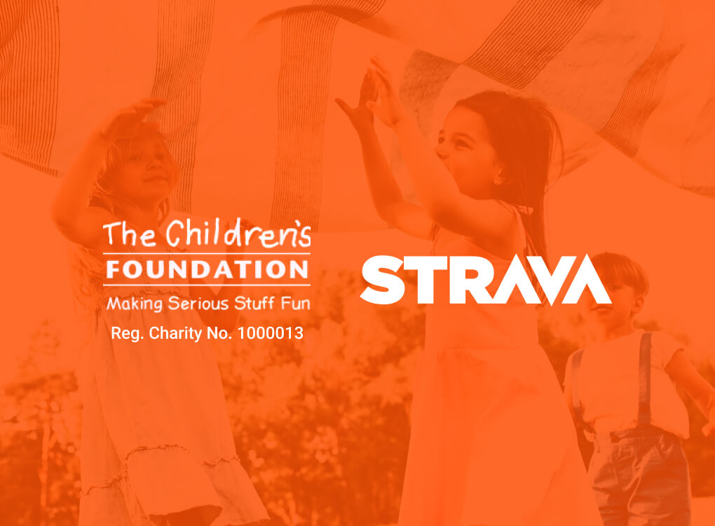 A photo showing children having fun at The Childrens Foundation with Orange Overlay show the TCF and Strava Logos